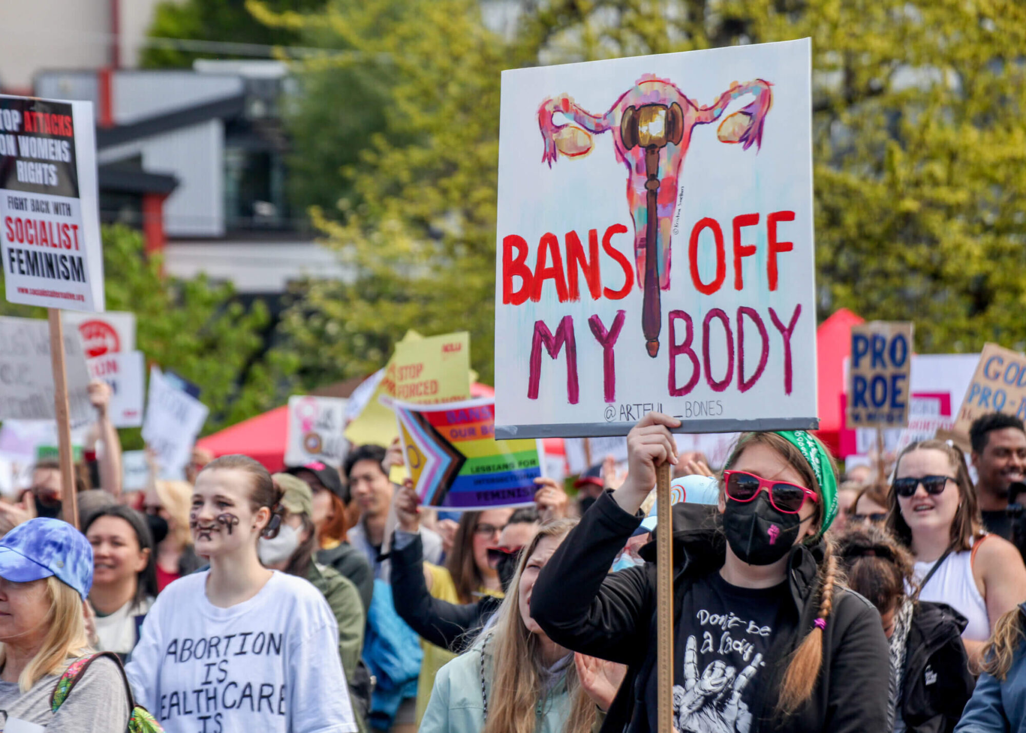 group of protestors behind a handmade Bans Off my Body sign