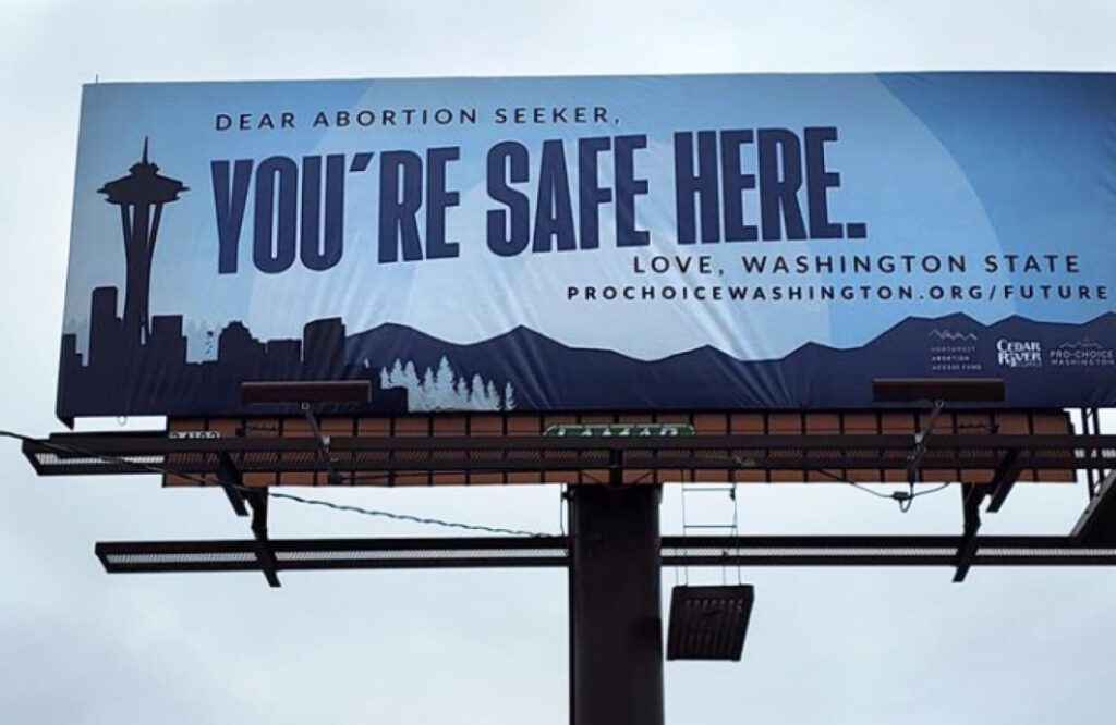 A billboard in Yakima, Washington reading "Dear Abortion Seeker, You're Safe Here. Love, Washington State"