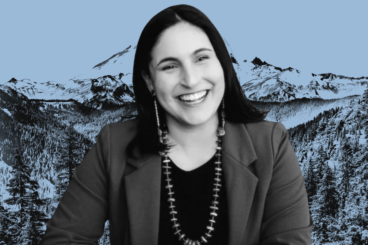 Black and white photo of Kim Harless over a blue mountain landscape